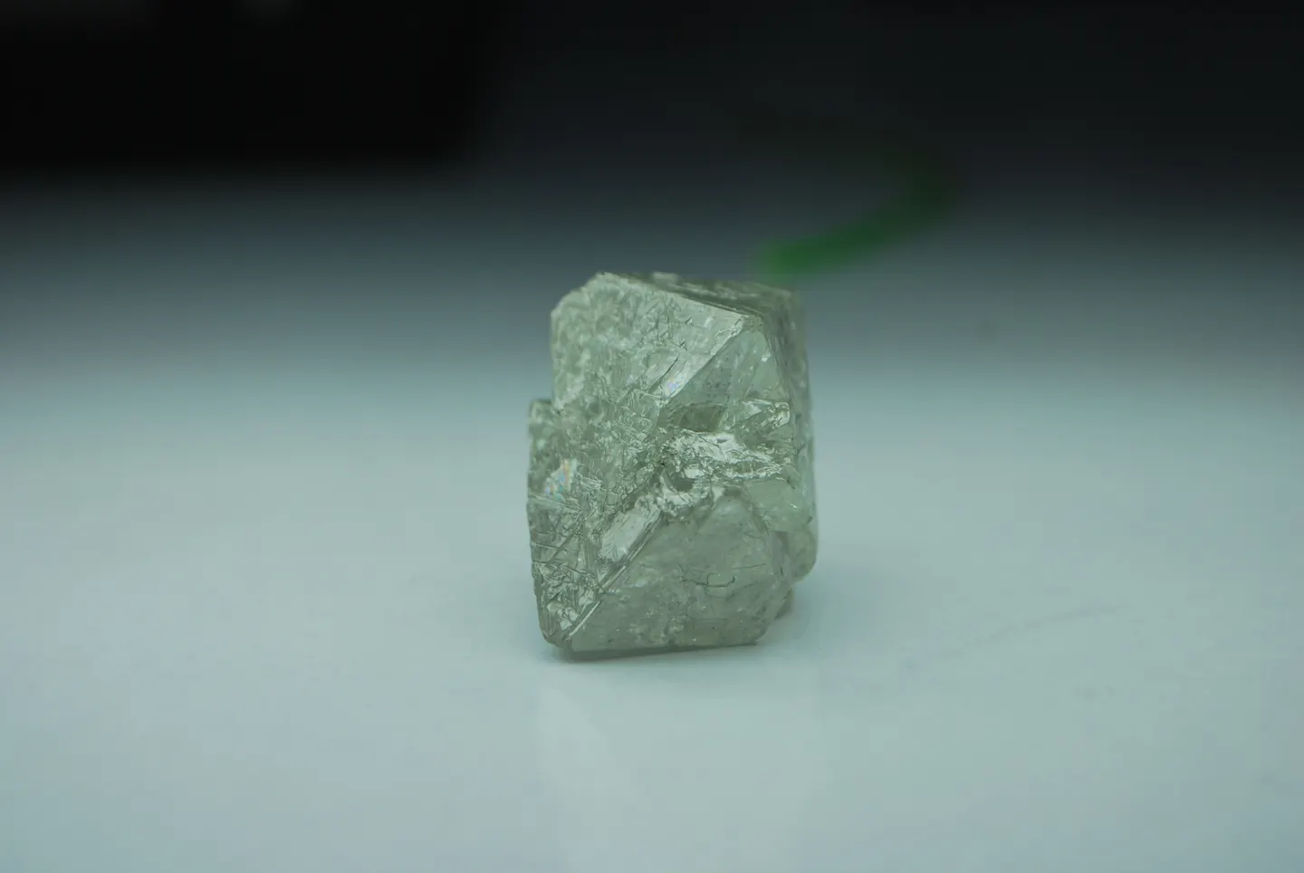 A rough laboratory-grown crystal photographed at Sitaram